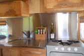 Very sharp kitchen cabinets and stainless steel countertops in 1949 Curtis Wright Trailer